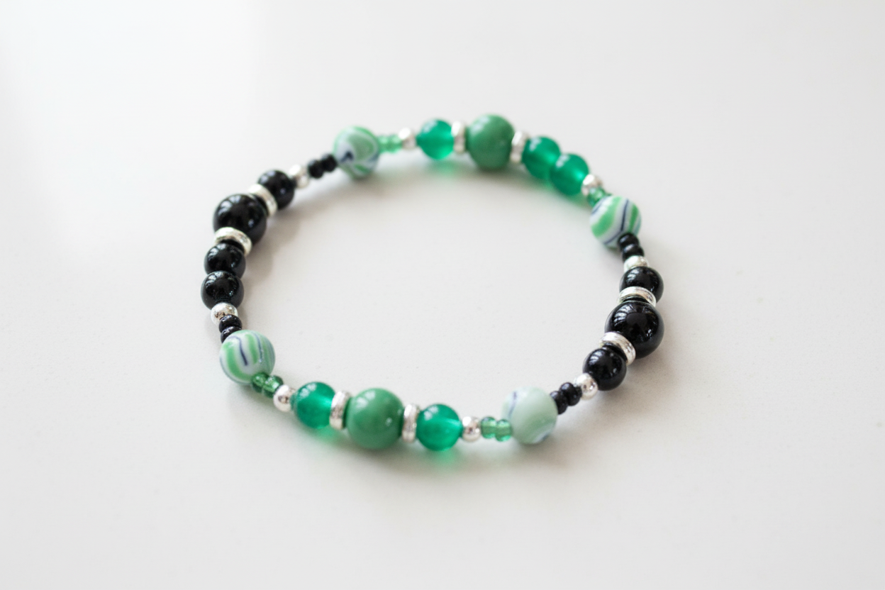 Bracelet - Elastic 6mm and 8mm black & green glass beads and 8mm acrylic green & black ink pattern beads and black & green seed beads and silver spacer beads