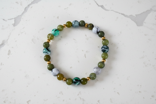 Bracelet - Elastic 6mm natural green jade with 8mm acrylic green & black ink pattern beads and gold spacer beads