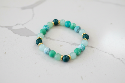 Bracelet - Elastic 8mm green & green patterned glass beads gold spacer beads