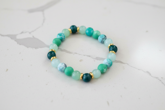 Bracelet - Elastic 8mm green & green patterned glass beads gold spacer beads