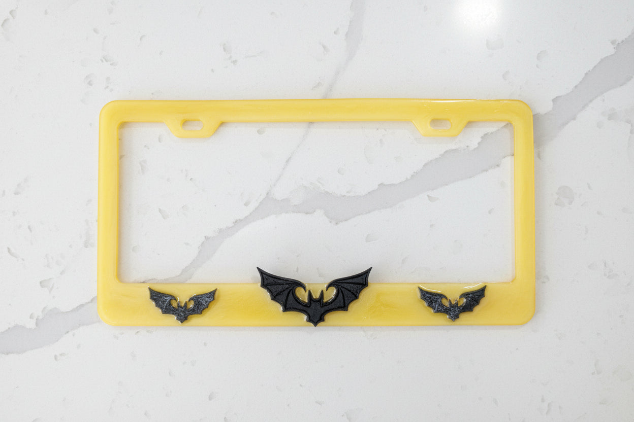 Handcrafted Resin Bat License Plate Holder – Swirly Yellow & Matte Black