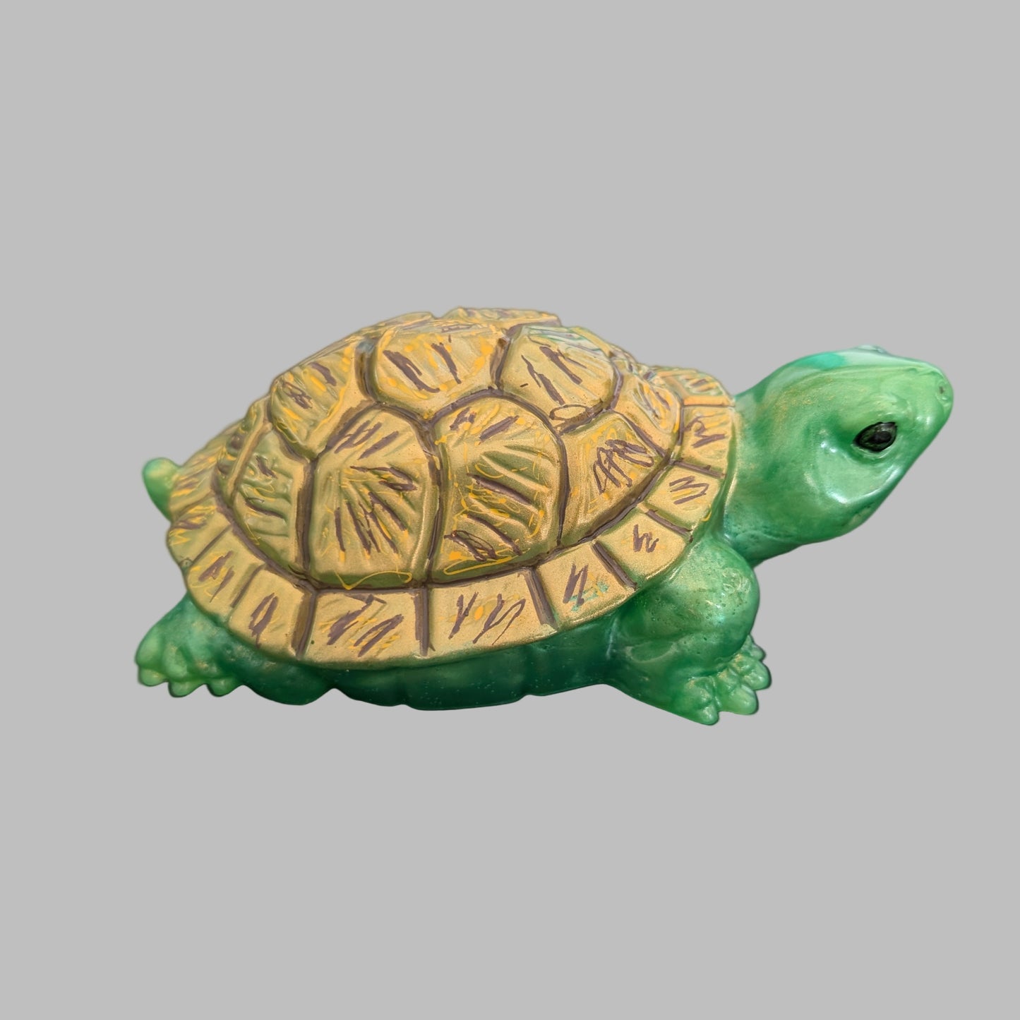 This charming resin turtle knickknack, measuring approximately 3 by 5.5 inches with a height of 2 inches, is a perfect decorative piece for any space.