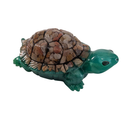 This charming resin turtle knickknack, measuring approximately 3 by 5.5 inches with a height of 2 inches, is a perfect decorative piece for any space.