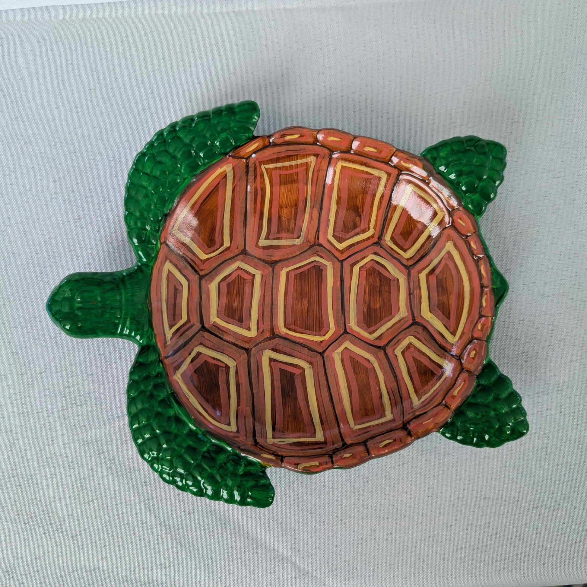 Resin Sea Turtle Tray

hand crafted with eco resin, and hand painted with acrylic paints.

Eco Resin feels similar to Ceramic or porcelain: smooth, cool to the touch, and non-plastic.