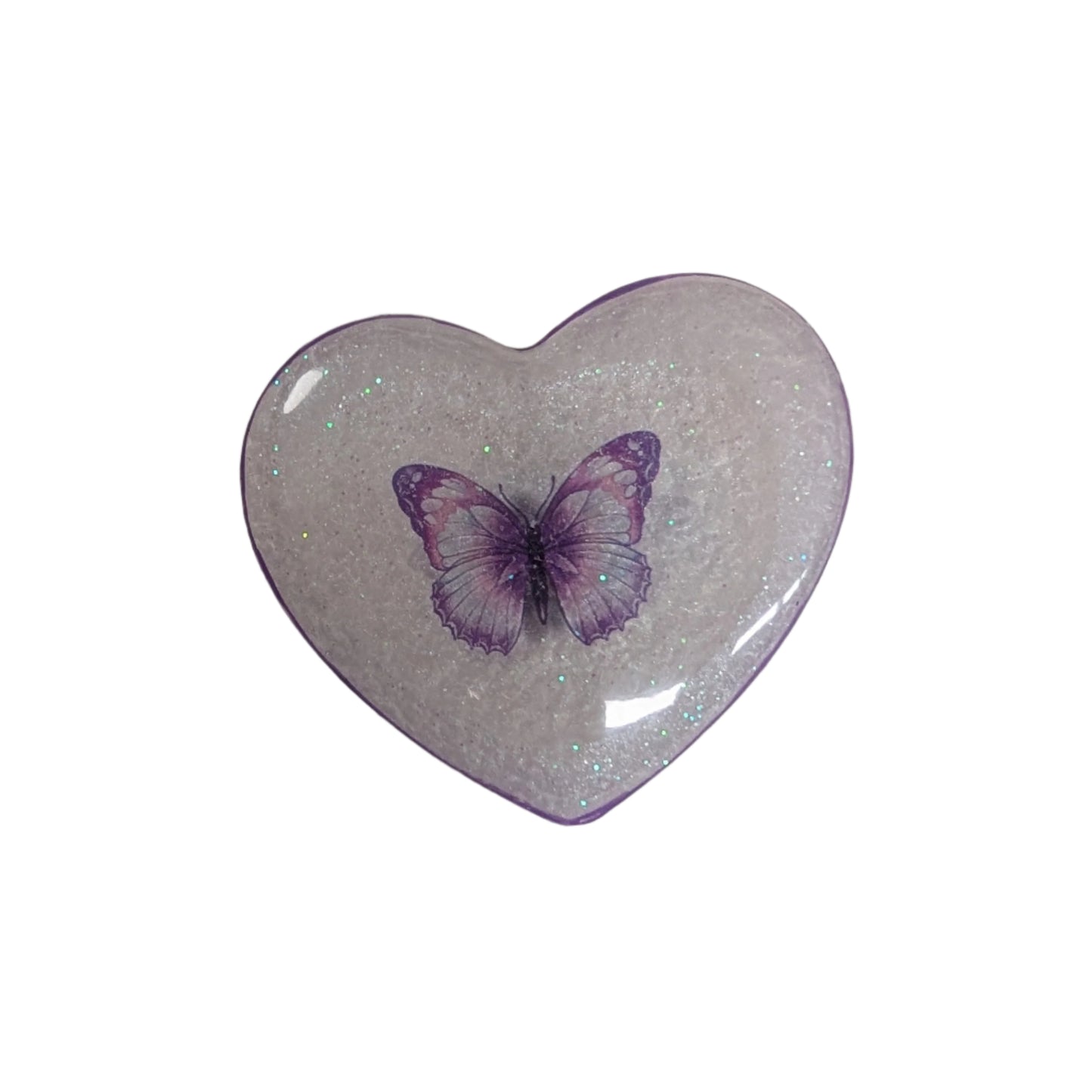 Wear your heart on your sleeve (or anywhere!) with this playful 3D resin heart pin. The silver butterfly clutch adds a touch of whimsy to this lightweight 0.40 oz accessory, measuring 1.75 x 2 in. Show your love with a pinch of quirkiness.

Pin - 3D resin heart pin with silver butterfly clutch
