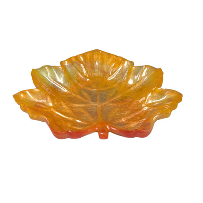 Elevate your space with the Knickknack Resin Maple Leaf Trinket Tray. Crafted with care, its vibrant maple leaf design adds a touch of nature-inspired charm while keeping your small essentials organized. Perfect for keys, jewelry, or coins, this tray combines functionality with seasonal style, making it a must-have accent for any room.