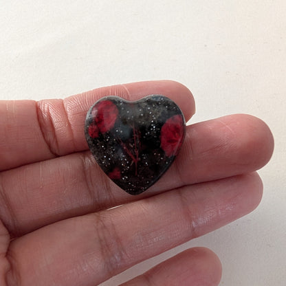 Add a touch of nature to your outfit with our Pin - 3D dried flower resin pin. The intricate design and 3D effect will surely catch everyone's eye. With the sturdy silver butterfly clutch, your pin will stay securely in place. Elevate your style with this unique and beautiful accessory.