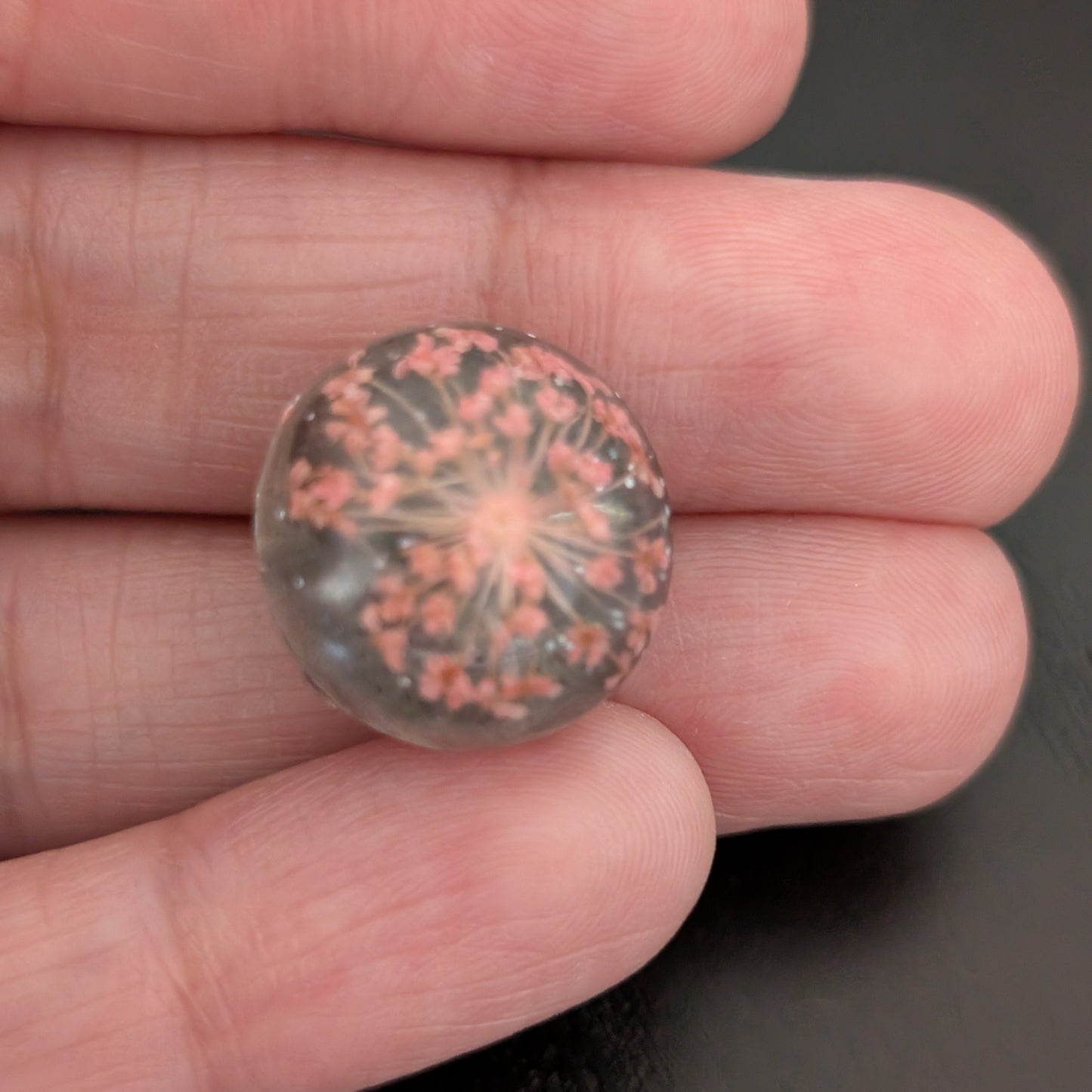 Add a touch of nature to your outfit with our Pin - 3D dried flower resin pin. The intricate design and 3D effect will surely catch everyone's eye. With the sturdy silver butterfly clutch, your pin will stay securely in place. Elevate your style with this unique and beautiful accessory.