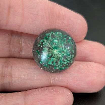 Add a touch of nature to your outfit with our Pin - 3D dried flower resin pin. The intricate design and 3D effect will surely catch everyone's eye. With the sturdy silver butterfly clutch, your pin will stay securely in place. Elevate your style with this unique and beautiful accessory.