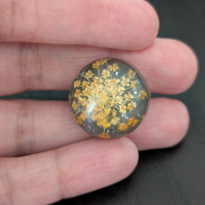 Add a touch of nature to your outfit with our Pin - 3D dried flower resin pin. The intricate design and 3D effect will surely catch everyone's eye. With the sturdy silver butterfly clutch, your pin will stay securely in place. Elevate your style with this unique and beautiful accessory.