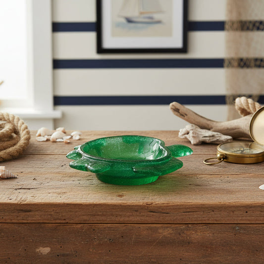 Bring a Splash of Coastal Charm to Your Home Add a touch of whimsical elegance to your space with our Handcrafted Sea Turtle Deep Dish. Meticulously poured from high-quality epoxy resin, this piece mimics the crystalline beauty of glass with the durability of hard plastic. Its deep-welled design makes it as functional as it is beautiful.