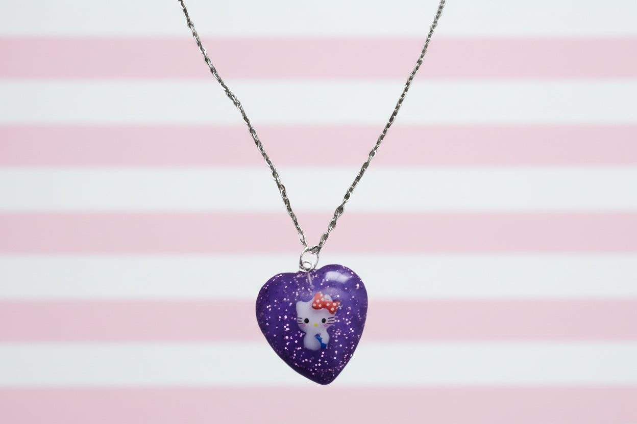 Elevate your accessory game with this stainless steel link cable chain necklace featuring a vibrant hello kitty character pendant. At 18.5 inches, it's the perfect length for everyday wear. Let this charming necklace add a touch of fun to your outfit and showcase your love for this beloved character.