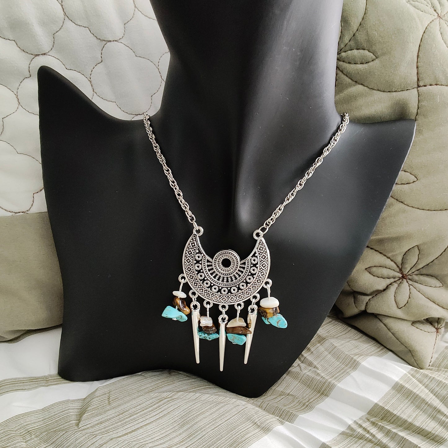 Elevate your style with our stunning Necklace - 22 inches Antique Chandelier Charm. Adorned with sparkling crystal beads and vintage cone shape dangles, it exudes elegance and charm. The stainless steel chain adds durability and a touch of modernity. Make a statement with this unique accessory!