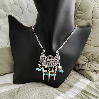 Elevate your style with our stunning Necklace - 22 inches Antique Chandelier Charm. Adorned with sparkling crystal beads and vintage cone shape dangles, it exudes elegance and charm. The stainless steel chain adds durability and a touch of modernity. Make a statement with this unique accessory!