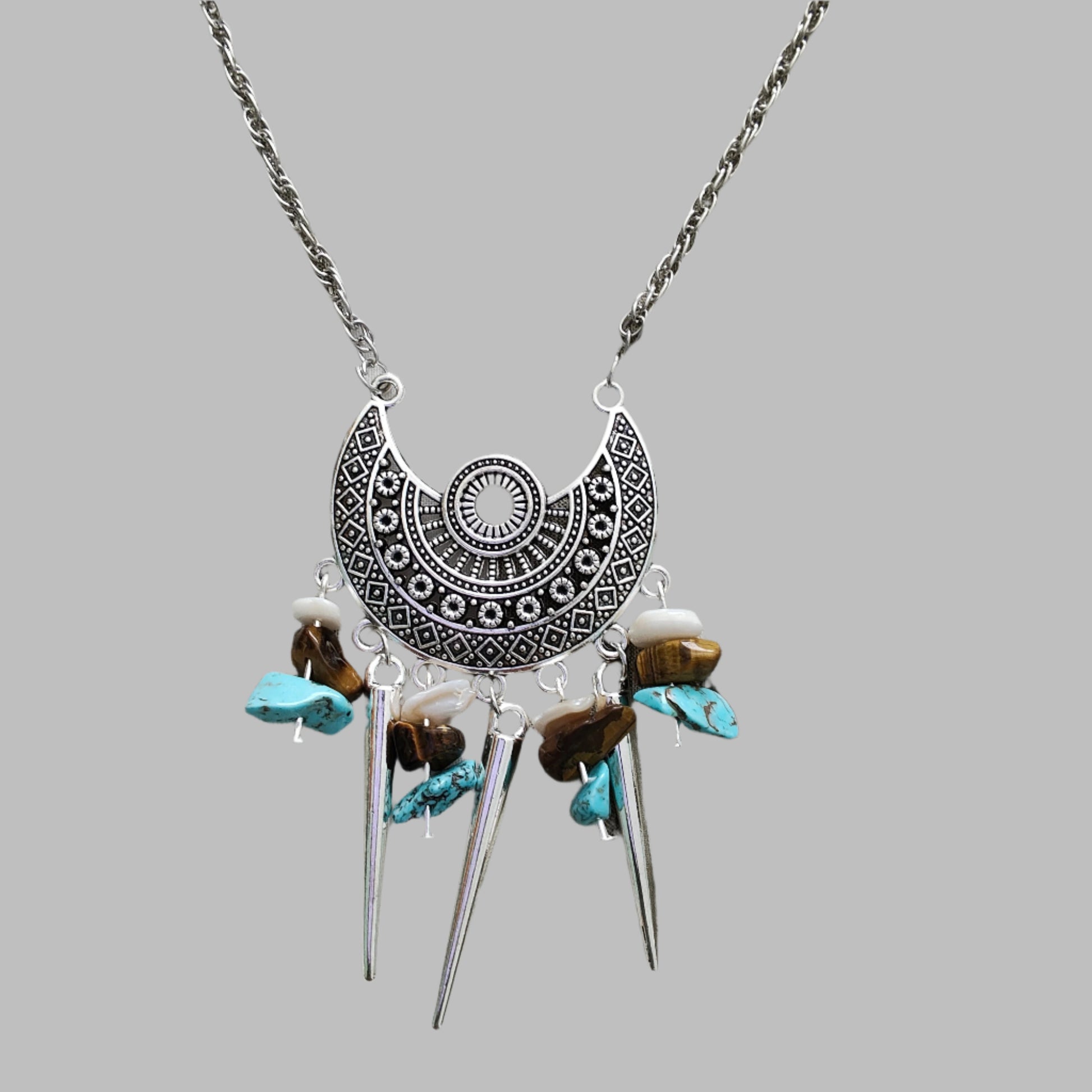 Elevate your style with our stunning Necklace - 22 inches Antique Chandelier Charm. Adorned with sparkling crystal beads and vintage cone shape dangles, it exudes elegance and charm. The stainless steel chain adds durability and a touch of modernity. Make a statement with this unique accessory!