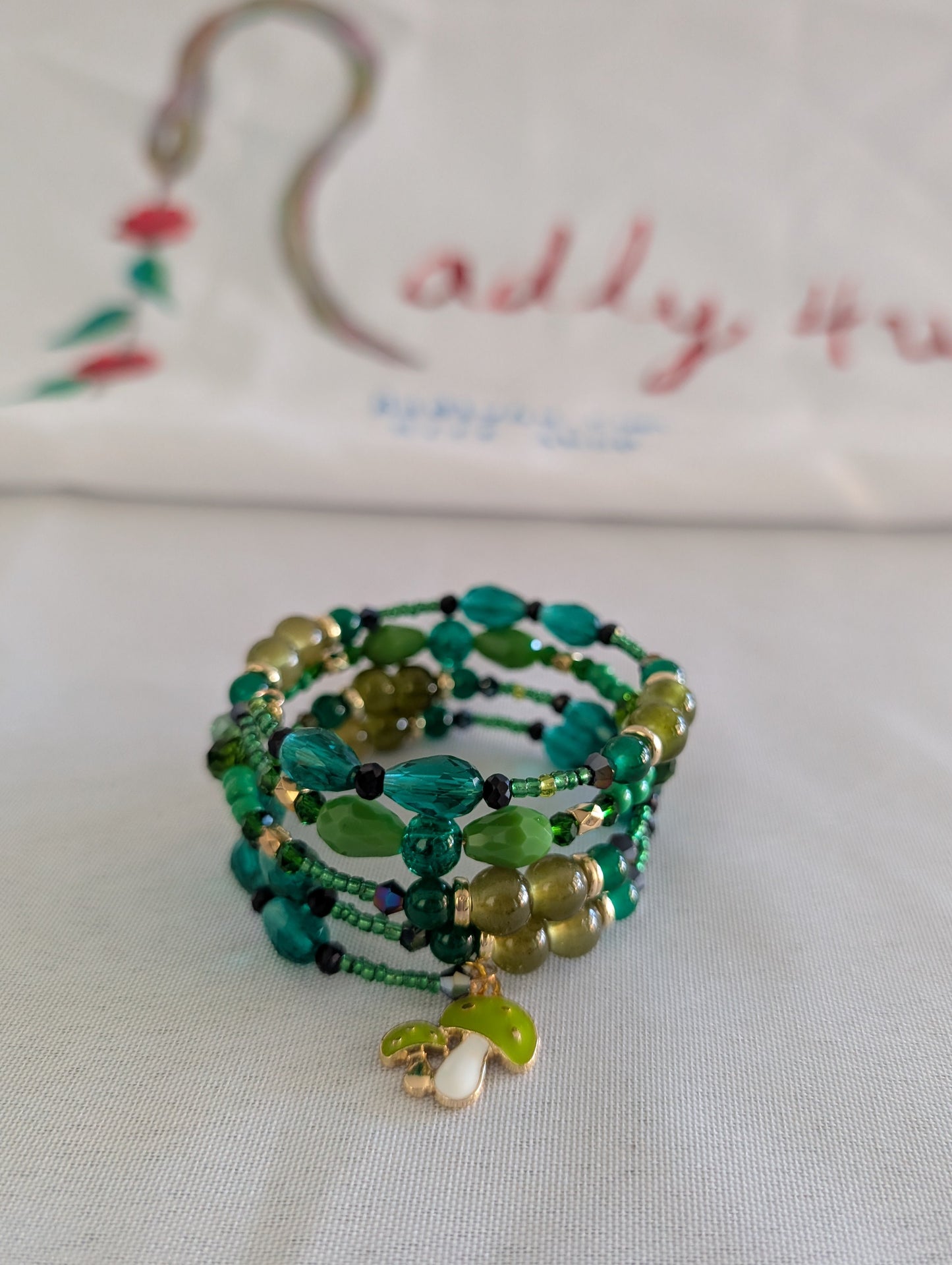 4 coil Boho Green Wrap Bracelet with mushroom charm