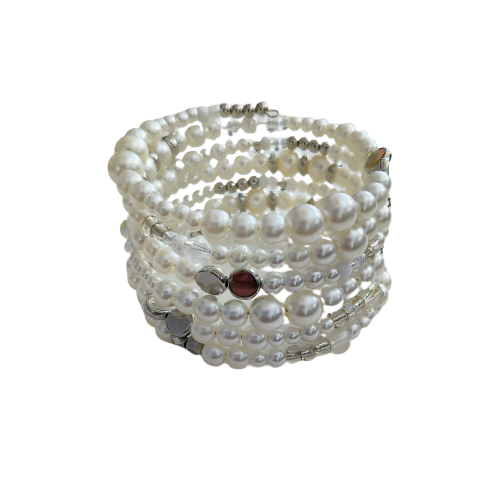 Experience elegance with our Memory Wire Bracelet featuring white pearl beads and silver spacer beads. Enhance any outfit with this versatile and stylish piece. Feel confident and glamorous with every wear!