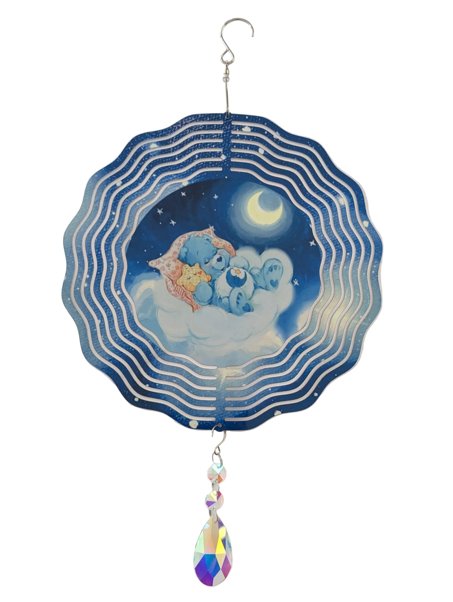 Bring whimsical charm to your outdoor space with this delightful 10-inch wind spinner showcasing Bedtime Care Bear on both sides. As it spins gracefully, stunning 4-inch teardrop crystal prisms dance with light, casting rainbow sparkles across your garden. Crafted from lightweight yet robust aluminum with a protective powder-coated finish, this spinner laughs in the face of rust and corrosion. The UV-treated image stays vibrant and cheerful through countless sunny days. Safe, smooth edges and hassle-free se