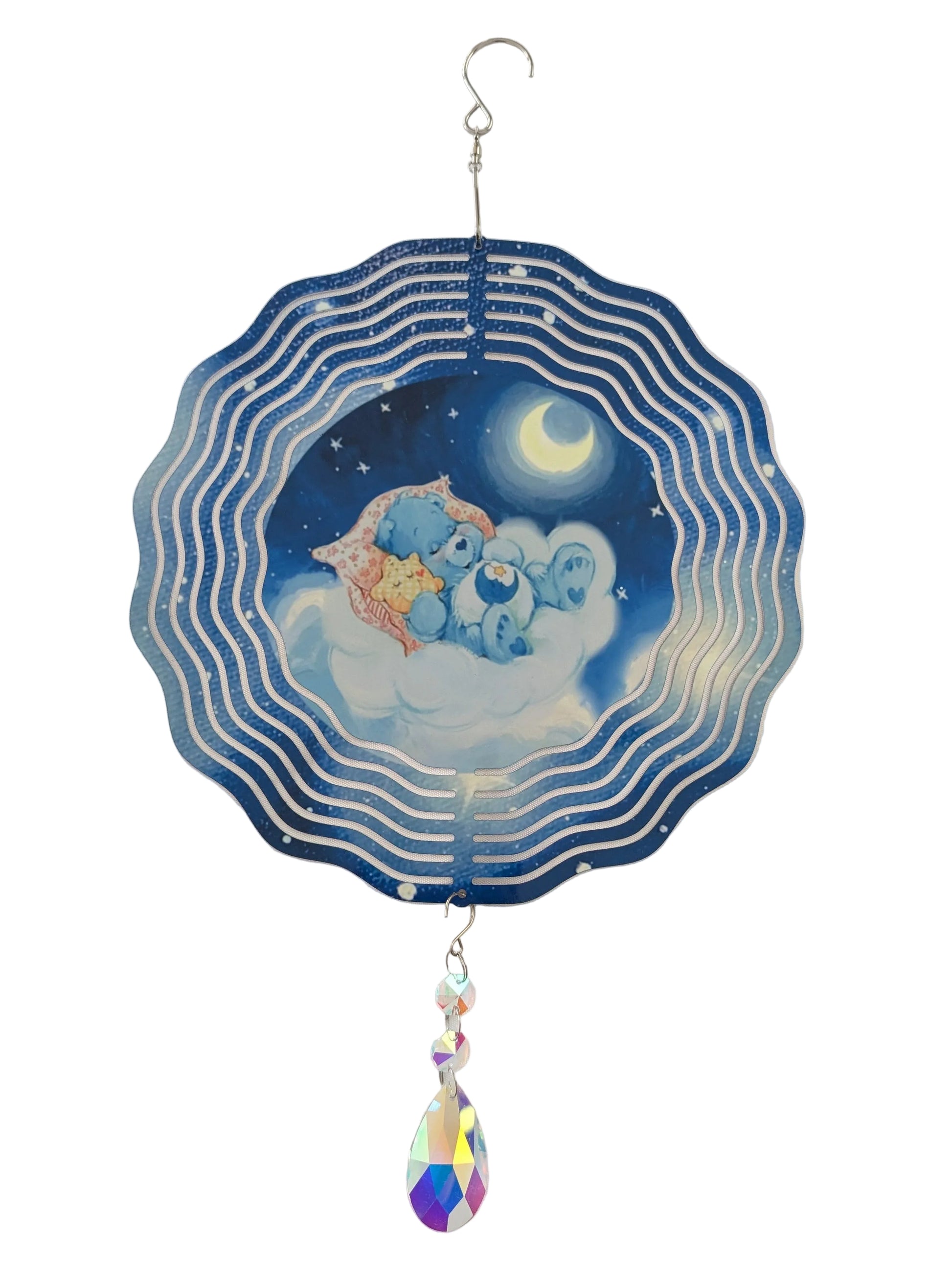 Bring whimsical charm to your outdoor space with this delightful 10-inch wind spinner showcasing Bedtime Care Bear on both sides. As it spins gracefully, stunning 4-inch teardrop crystal prisms dance with light, casting rainbow sparkles across your garden. Crafted from lightweight yet robust aluminum with a protective powder-coated finish, this spinner laughs in the face of rust and corrosion. The UV-treated image stays vibrant and cheerful through countless sunny days. Safe, smooth edges and hassle-free se