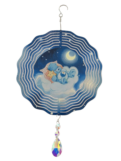 Bring whimsical charm to your outdoor space with this delightful 10-inch wind spinner showcasing Bedtime Care Bear on both sides. As it spins gracefully, stunning 4-inch teardrop crystal prisms dance with light, casting rainbow sparkles across your garden. Crafted from lightweight yet robust aluminum with a protective powder-coated finish, this spinner laughs in the face of rust and corrosion. The UV-treated image stays vibrant and cheerful through countless sunny days. Safe, smooth edges and hassle-free se
