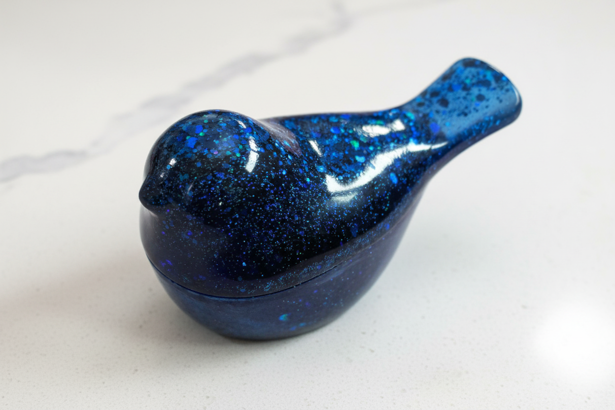 A blue resin bird with lid trinket 