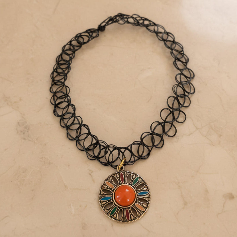 Slip on effortless style with this adjustable stretchy elastic necklace featuring a gorgeous boho antique gold charm. 