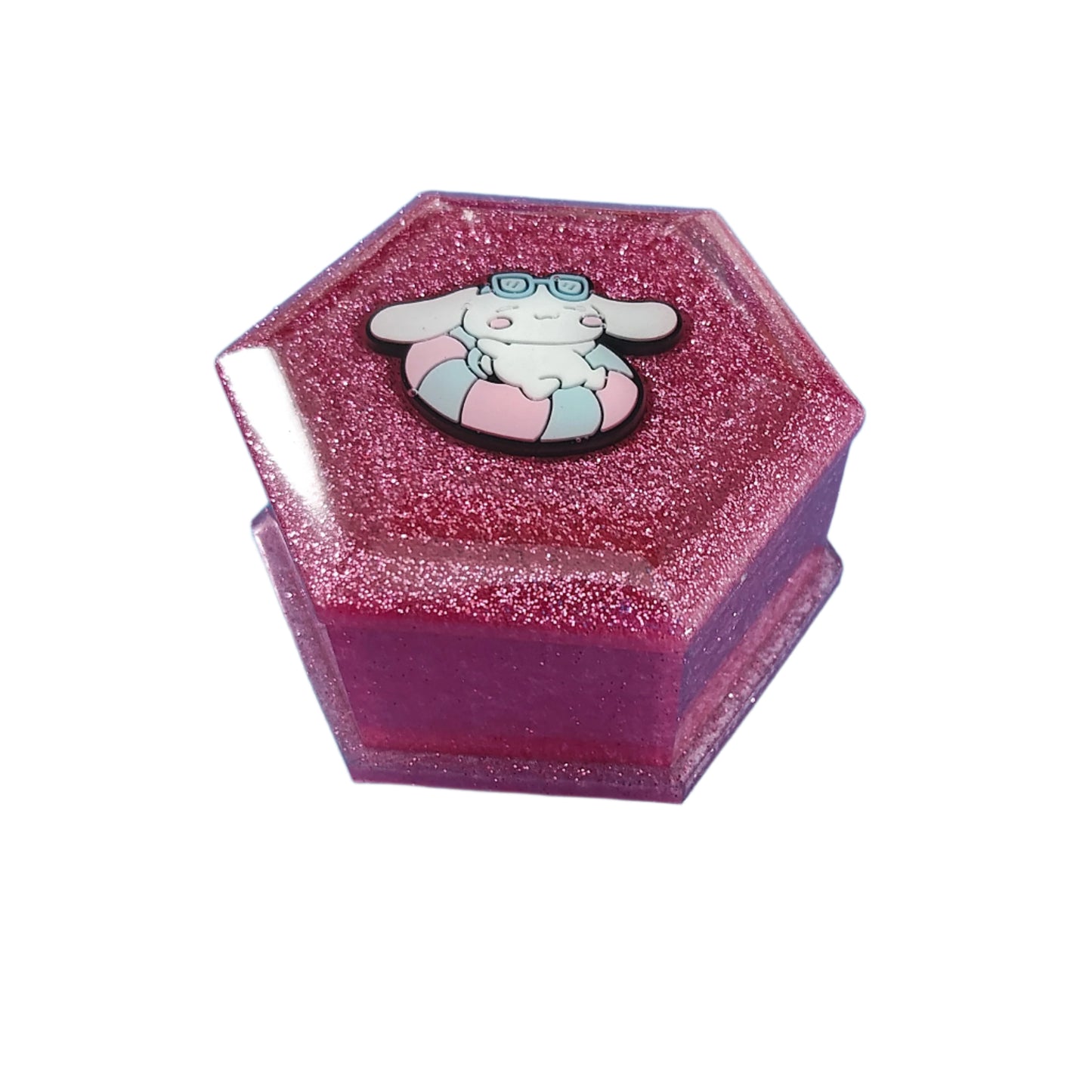 Add a touch of whimsy to your jewelry collection with our Knickknack Resin Hexagon Jewelry Box. The character lid adds a playful element to your storage, while the resin material ensures durability and protection for your precious pieces. Keep your jewelry safe and organized with this unique and charming box.