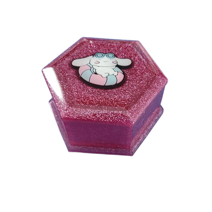 Add a touch of whimsy to your jewelry collection with our Knickknack Resin Hexagon Jewelry Box. The character lid adds a playful element to your storage, while the resin material ensures durability and protection for your precious pieces. Keep your jewelry safe and organized with this unique and charming box.