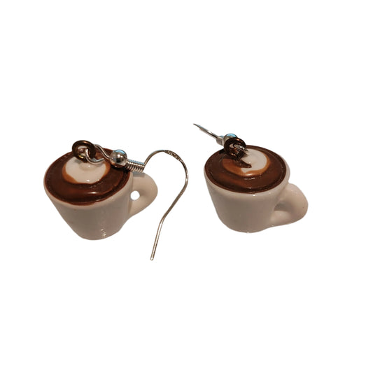 Add a touch of whimsy to your outfit with these coffee mug charm earrings. Made with a porcelain mug on a silver hook, these earrings are approximately 1.25 inches long and weigh 0.16 oz. Perfect for the coffee lover in your life!