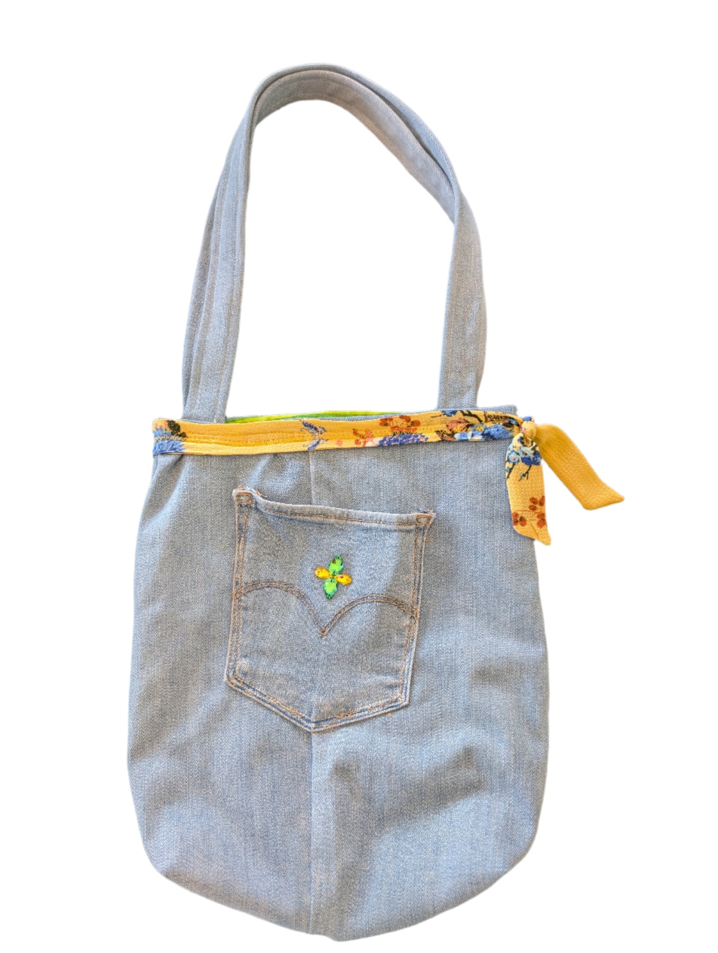 Showcase your eco-conscious style with this captivating Jean Bag featuring dazzling rhinestone accents, a charming yellow floral detail, and vibrant green-yellow striped lining. Perfectly sized at 10.5×11.5×2.5 inches with comfortable 26-inch straps, this versatile accessory effortlessly carries all your daily essentials—from your phone and wallet to sunglasses and more. Crafted thoughtfully from a blend of refurbished and new materials, this bag lets you make a fashion statement while reducing environmenta