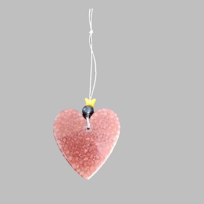 Feel the freshness of nature with Freshie's Heart With Bead air freshener! Enjoy the pleasing scent and unique design of this delightful product. Refresh your home and cars with this beautiful, eye-catching air freshener!