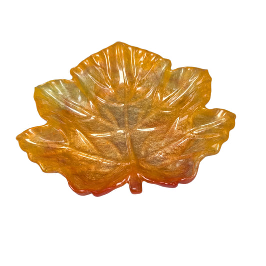 Elevate your space with the Knickknack Resin Maple Leaf Trinket Tray. Crafted with care, its vibrant maple leaf design adds a touch of nature-inspired charm while keeping your small essentials organized. Perfect for keys, jewelry, or coins, this tray combines functionality with seasonal style, making it a must-have accent for any room.