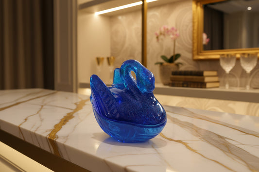 Blue glitter resin swan jewelry dish for home decor.