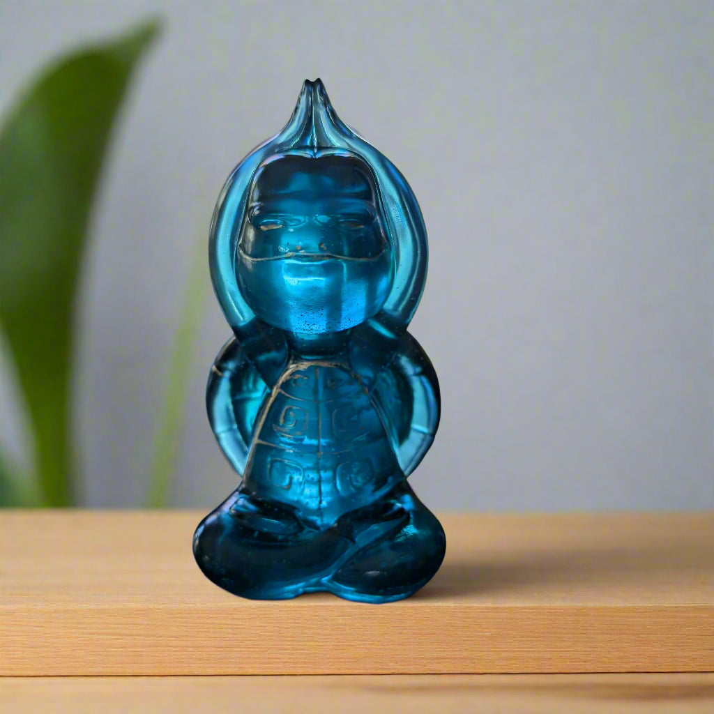 Add a peaceful touch to your space with this resin Yoga/Meditation turtle trinket. Standing 5.25 inches tall and measuring 2.75 by 2.75 inches, its compact size fits perfectly on desks or shelves. Weighing just 8 ounces, it’s stable yet lightweight enough to move around easily. This charming turtle symbolizes tranquility and mindfulness, making it an ideal companion for your meditation or yoga practice. Bring calm and positive energy into your home or office with this unique decorative piece.