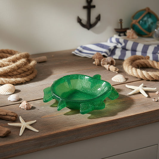 Bring a Splash of Coastal Charm to Your Home Add a touch of whimsical elegance to your space with our Handcrafted Sea Turtle Deep Dish. Meticulously poured from high-quality epoxy resin, this piece mimics the crystalline beauty of glass with the durability of hard plastic. Its deep-welled design makes it as functional as it is beautiful.