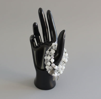 Celebrate wisdom and grace with this luminous elastic bracelet featuring a charming silver elephant charm. Strung with 8mm white and clear beads that sparkle with crystal and glass accents, complemented by delicate silver spacers, this piece radiates understated elegance. The elastic design stretches to fit comfortably on any wrist—no clasps needed—making it perfect for everyday wear or stacking with your favorite bracelets. At just 0.50 oz, it's lightweight enough to wear all day without fatigue. Whether y