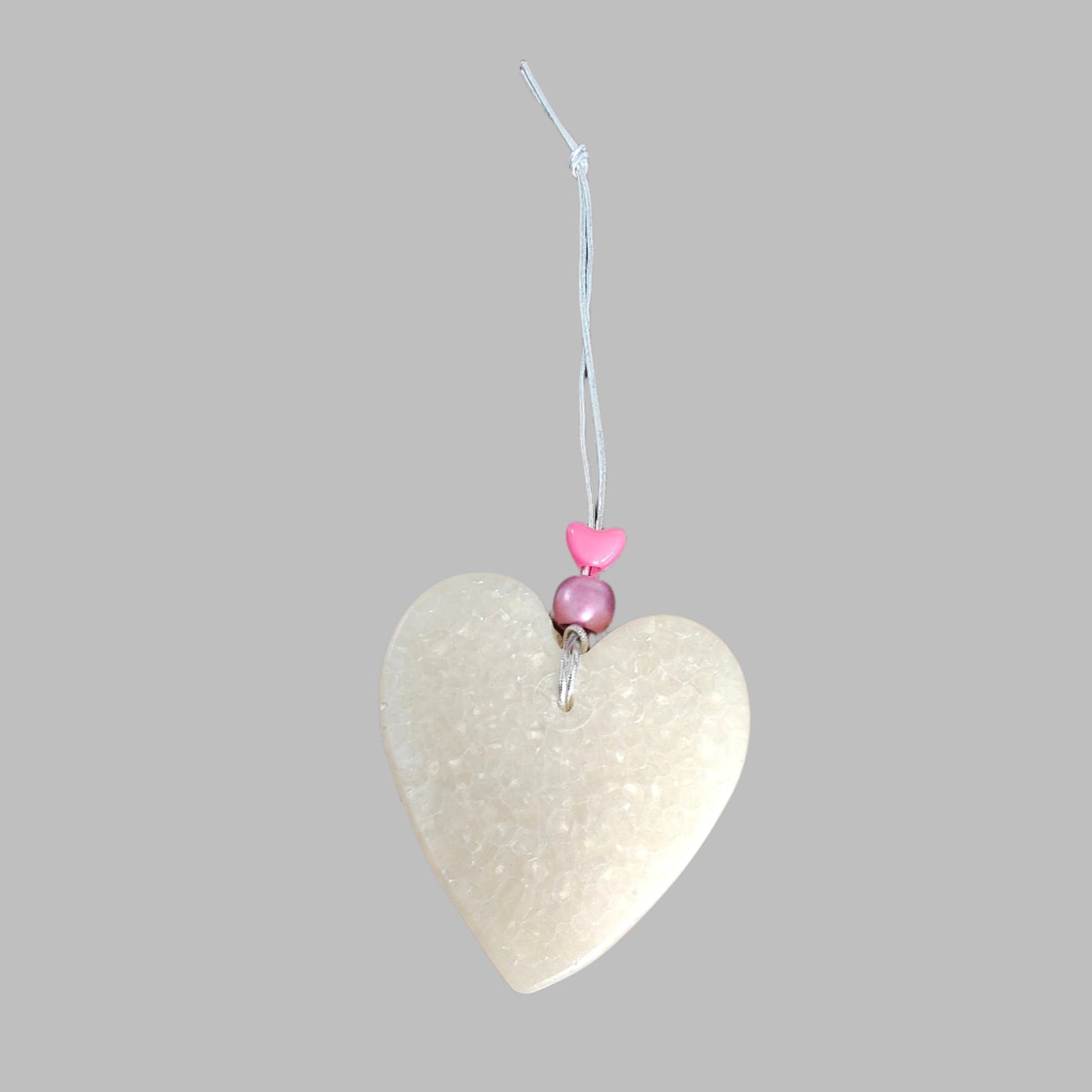 Feel the freshness of nature with Freshie's Heart With Bead air freshener! Enjoy the pleasing scent and unique design of this delightful product. Refresh your home and cars with this beautiful, eye-catching air freshener!