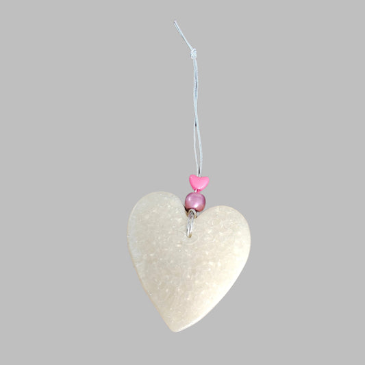 Feel the freshness of nature with Freshie's Heart With Bead air freshener! Enjoy the pleasing scent and unique design of this delightful product. Refresh your home and cars with this beautiful, eye-catching air freshener!