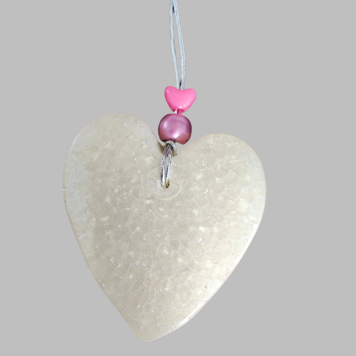 Feel the freshness of nature with Freshie's Heart With Bead air freshener! Enjoy the pleasing scent and unique design of this delightful product. Refresh your home and cars with this beautiful, eye-catching air freshener!