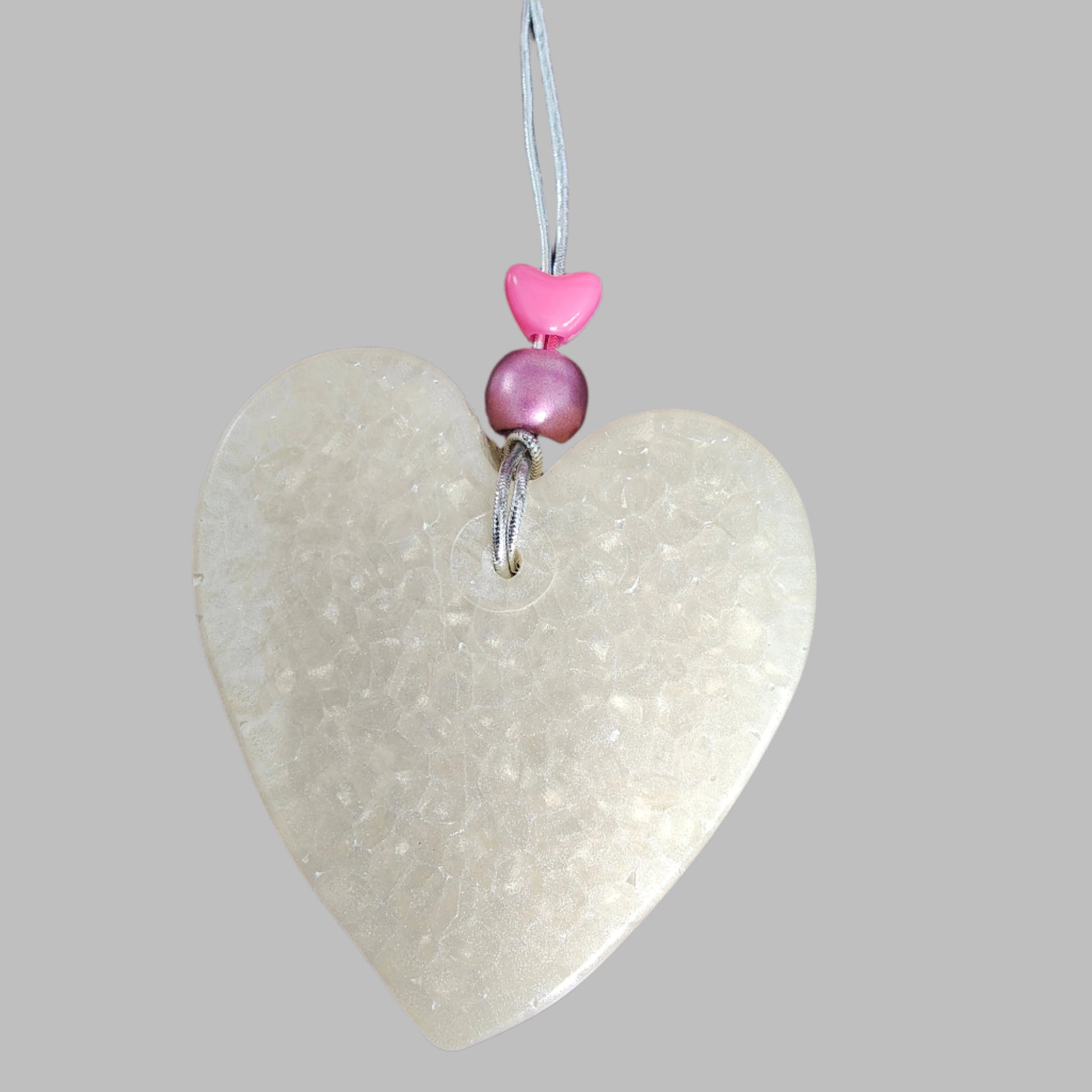 Feel the freshness of nature with Freshie's Heart With Bead air freshener! Enjoy the pleasing scent and unique design of this delightful product. Refresh your home and cars with this beautiful, eye-catching air freshener!