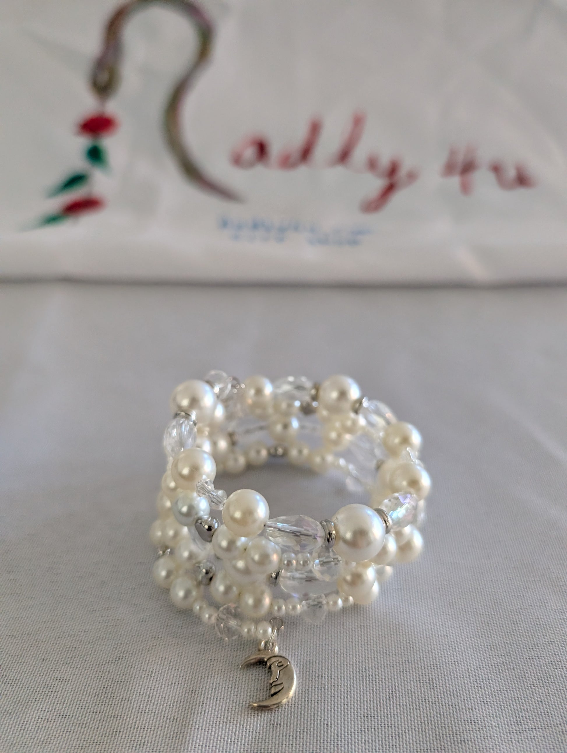 Experience elegance with our Memory Wire Bracelet featuring white pearl beads and silver spacer beads. Enhance any outfit with this versatile and stylish piece. Feel confident and glamorous with every wear!