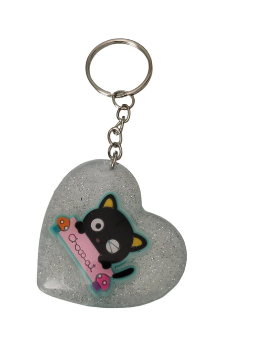 Elevate your everyday essentials with our Keychain 3D resin chococat heart keychain! Showcase your love for Sanrio's iconic character with this adorable and durable accessory. The detailed 3D resin design adds a touch of cuteness to your keys or bag, making it both stylish and functional.