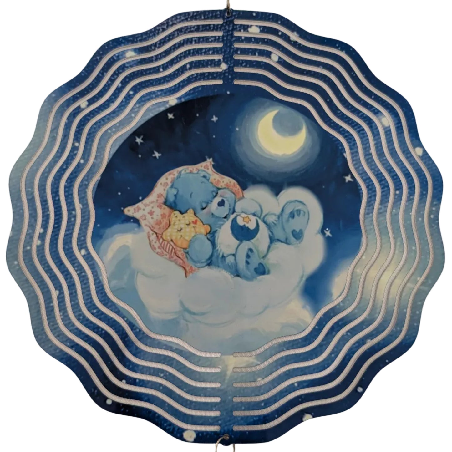 Bring whimsical charm to your outdoor space with this delightful 10-inch wind spinner showcasing Bedtime Care Bear on both sides. As it spins gracefully, stunning 4-inch teardrop crystal prisms dance with light, casting rainbow sparkles across your garden. Crafted from lightweight yet robust aluminum with a protective powder-coated finish, this spinner laughs in the face of rust and corrosion. The UV-treated image stays vibrant and cheerful through countless sunny days. Safe, smooth edges and hassle-free se