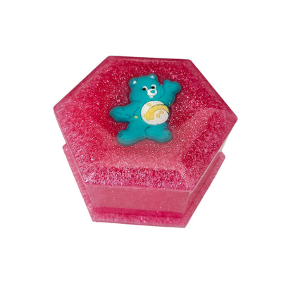 Add a touch of whimsy to your jewelry collection with our Knickknack Resin Hexagon Jewelry Box. The character lid adds a playful element to your storage, while the resin material ensures durability and protection for your precious pieces. Keep your jewelry safe and organized with this unique and charming box.