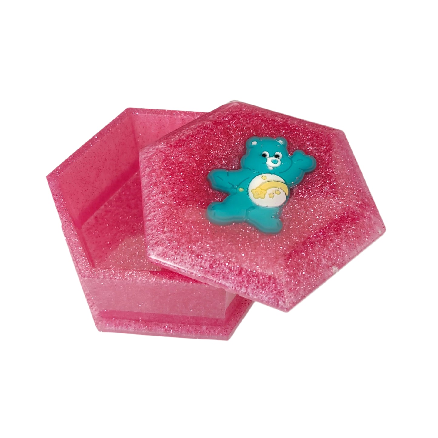 Add a touch of whimsy to your jewelry collection with our Knickknack Resin Hexagon Jewelry Box. The character lid adds a playful element to your storage, while the resin material ensures durability and protection for your precious pieces. Keep your jewelry safe and organized with this unique and charming box.