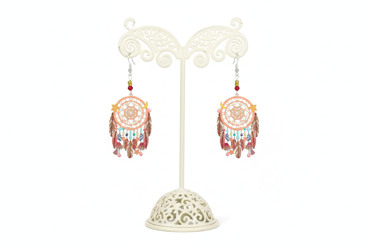 A pair of dream catcher earrings with beads, featuring a silver hook and intricate filigree design, predominantly in pink and multicolor tones.