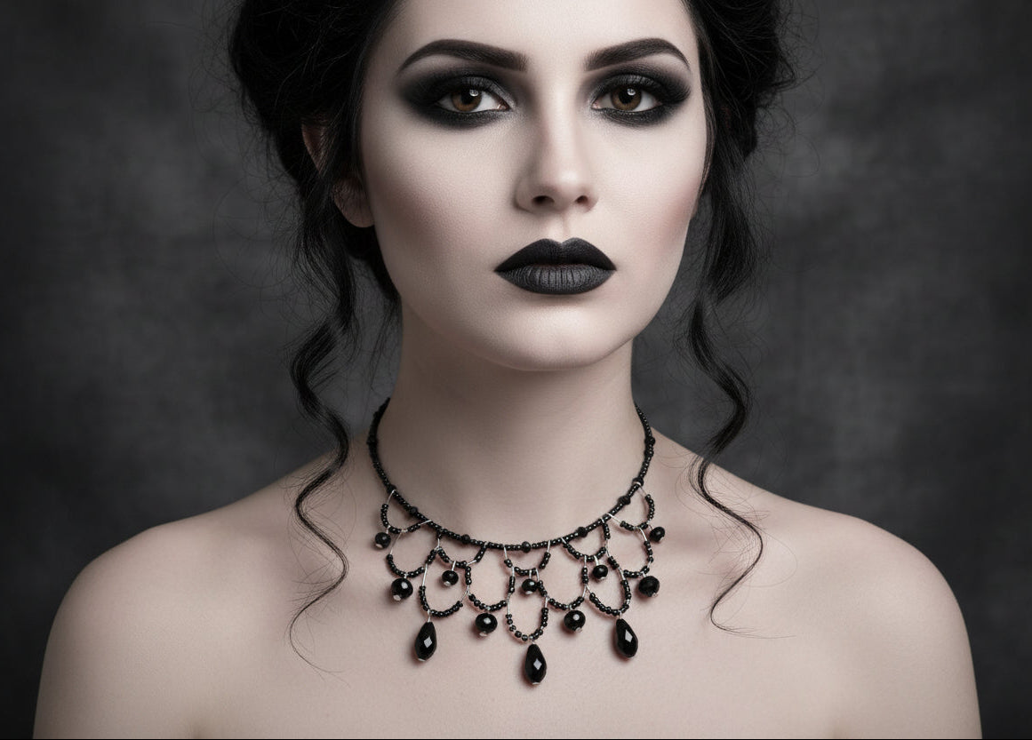 Woman wearing a black necklace against a dark background