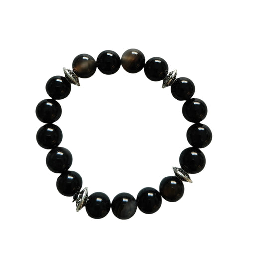Experience the power of natural gemstones with our Black Stripe Agate Bracelet. The 6mm beads are expertly crafted for a comfortable elastic fit. The striking black stripes are complemented by silver spacer beads, adding a touch of elegance to this unique accessory. Feel confident and stylish with every wear!