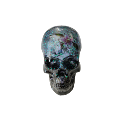 Add a unique touch to your home decor with our Knickknack - Resin small skull. Made with high-quality resin, this skull is a perfect blend of edginess and creativity. Elevate your space with this eye-catching piece that will surely spark your imagination.