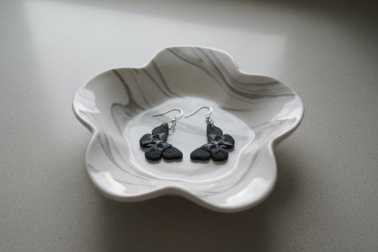 Earrings - Resin butterfly with skull face on hook